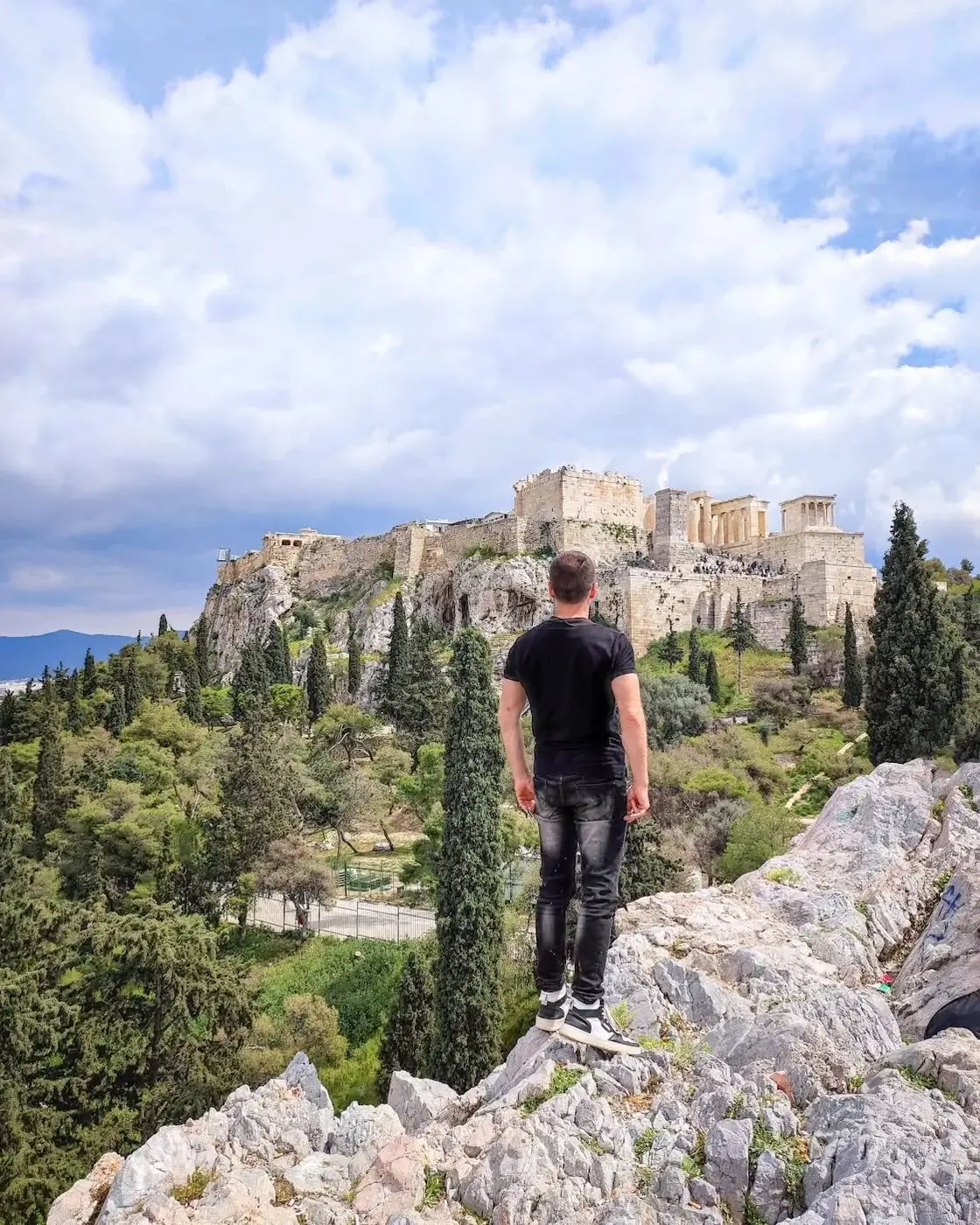 Danny on a rock looking toward the Acropolis