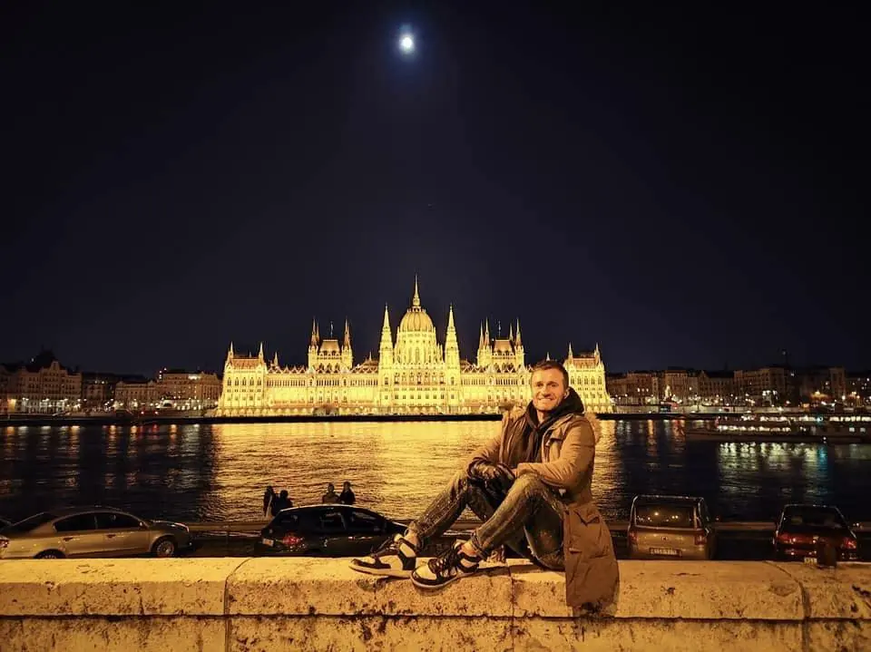 Danny by the Danube at night with the Hungarian Parliament lit up