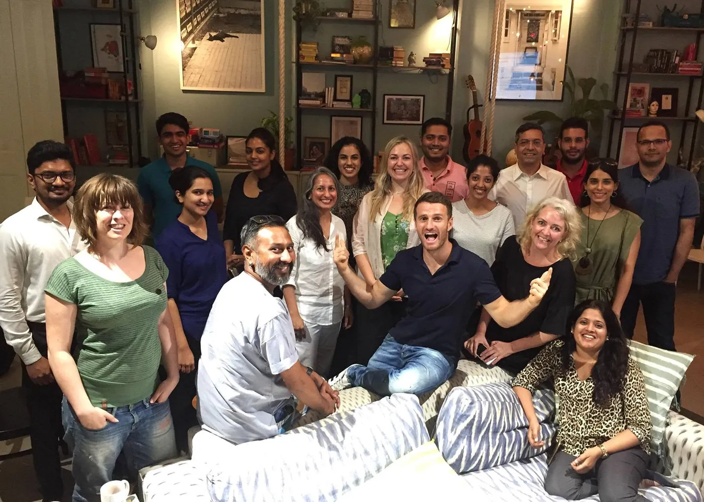 Danny with workshop attendees and host Marlies on a couch in Mumbai