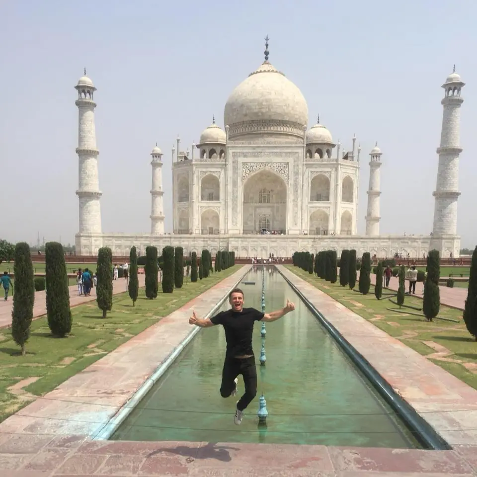 Danny jumping in front of the Taj Mahal